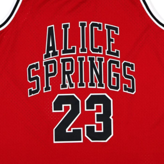 Menβs red and black basketball jersey featuring Slice Springs and number 23