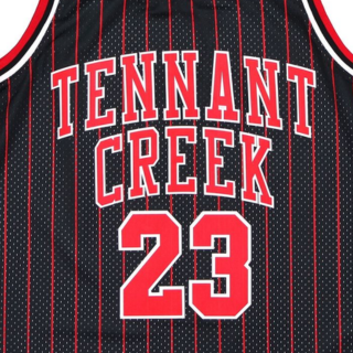 Menβs white and red-black basketball jersey featuring Tennant Creek and number 23